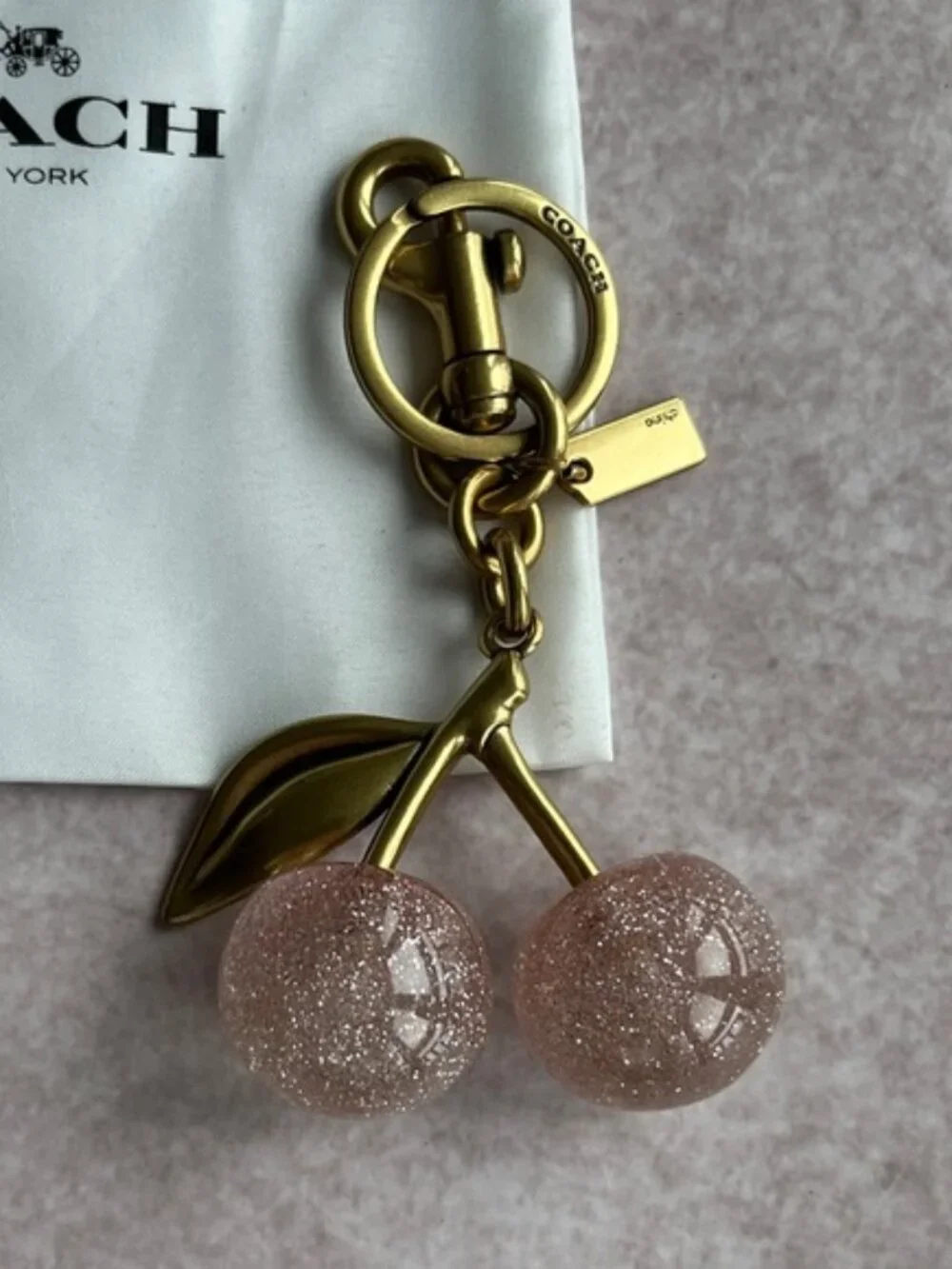 COACH Pink Glitter Cherry Bag Charm with Gold Hardware